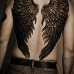 Значение татуировки крылья на спине 7