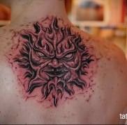 татуировка солнце – с мордой демона – пылающий и страшный рисунок